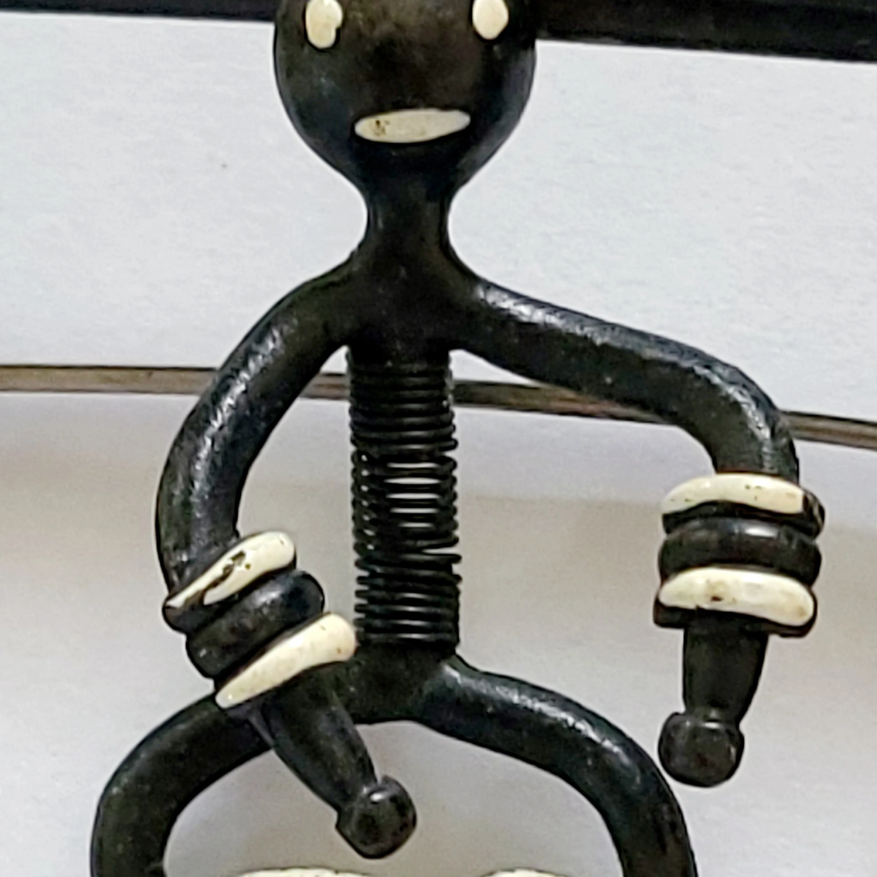 Black Enameled Bongo Drummer Trembler Brooch