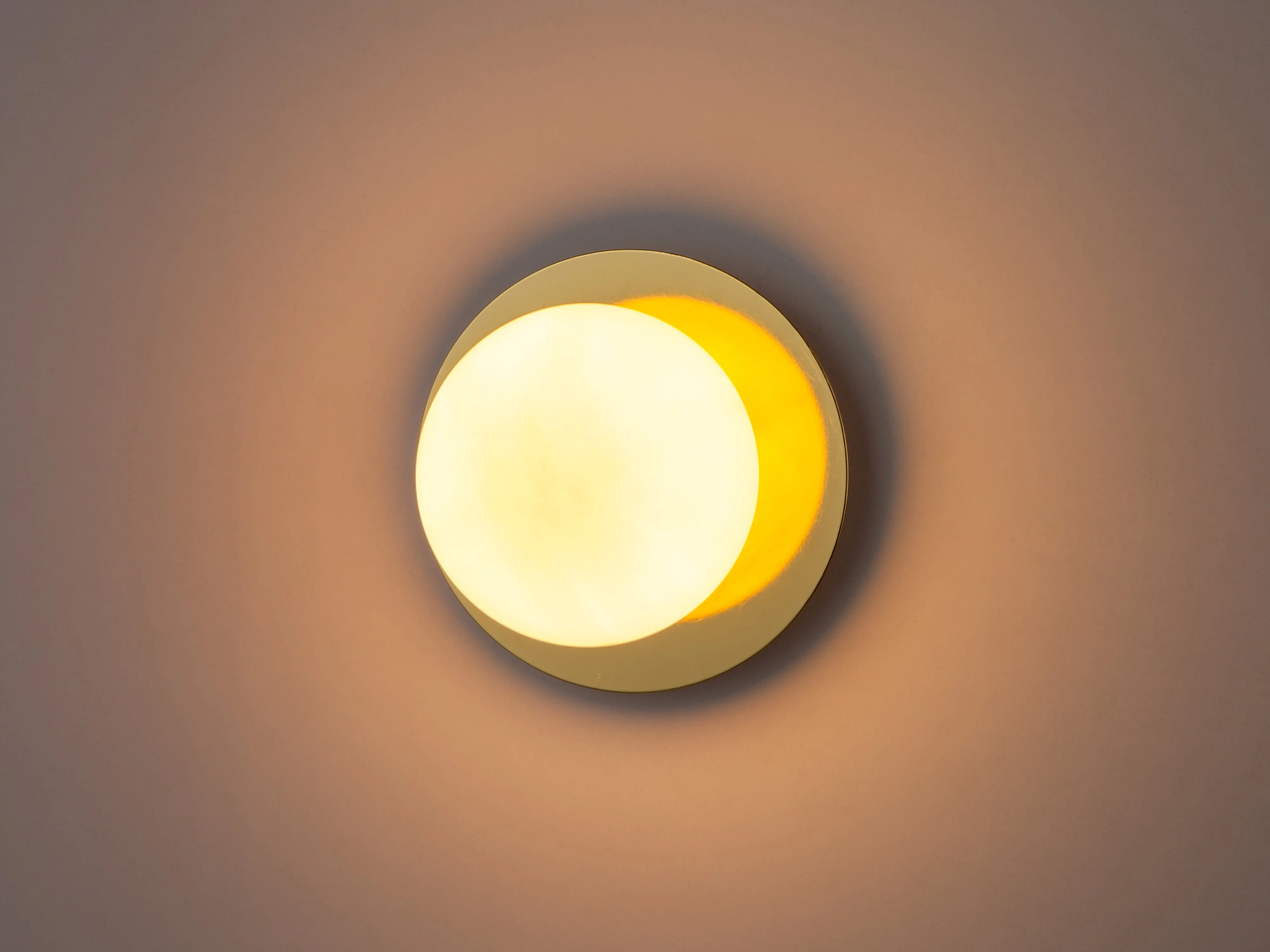 Brass opal disk wall light