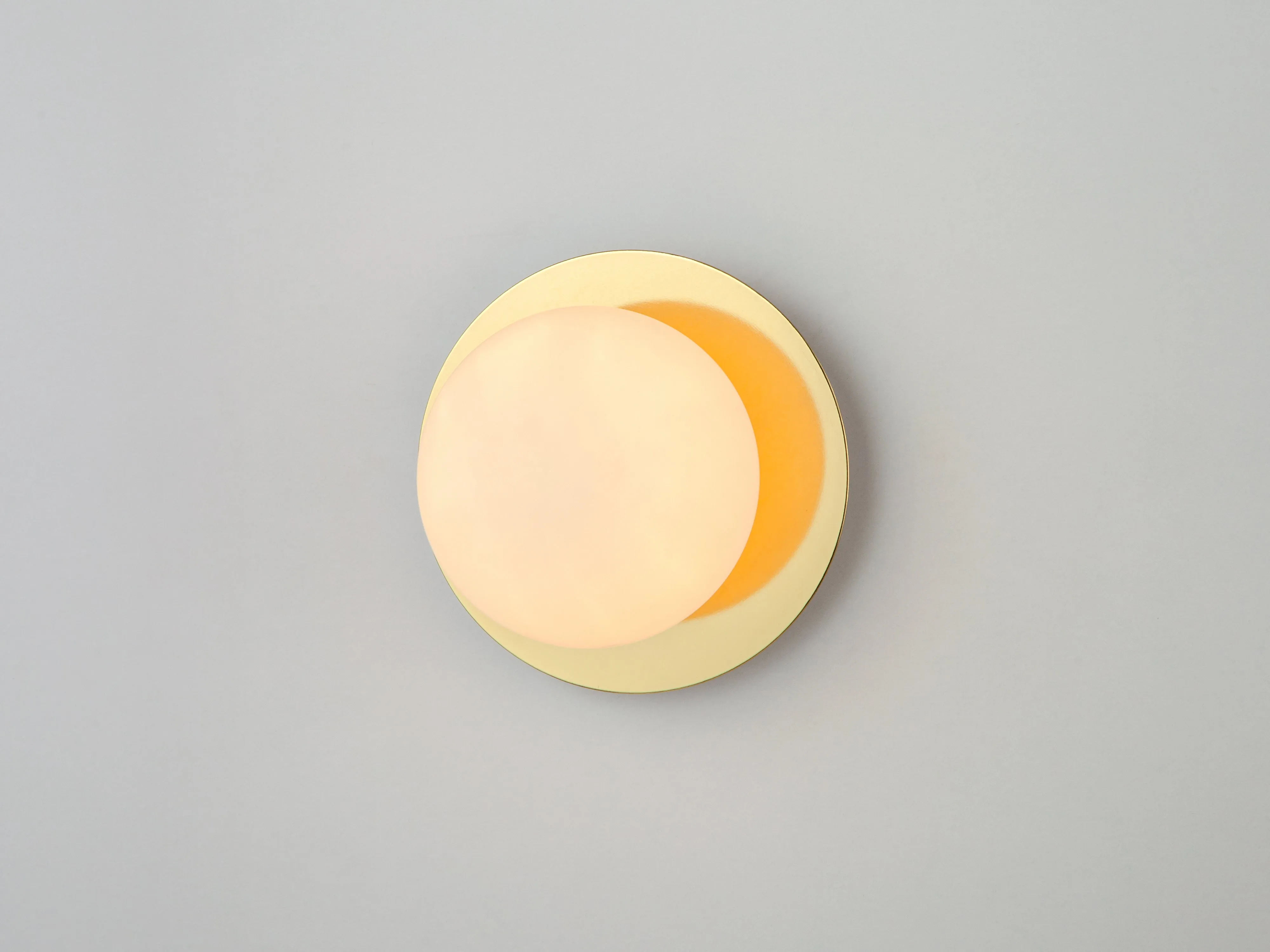 Brass opal disk wall light