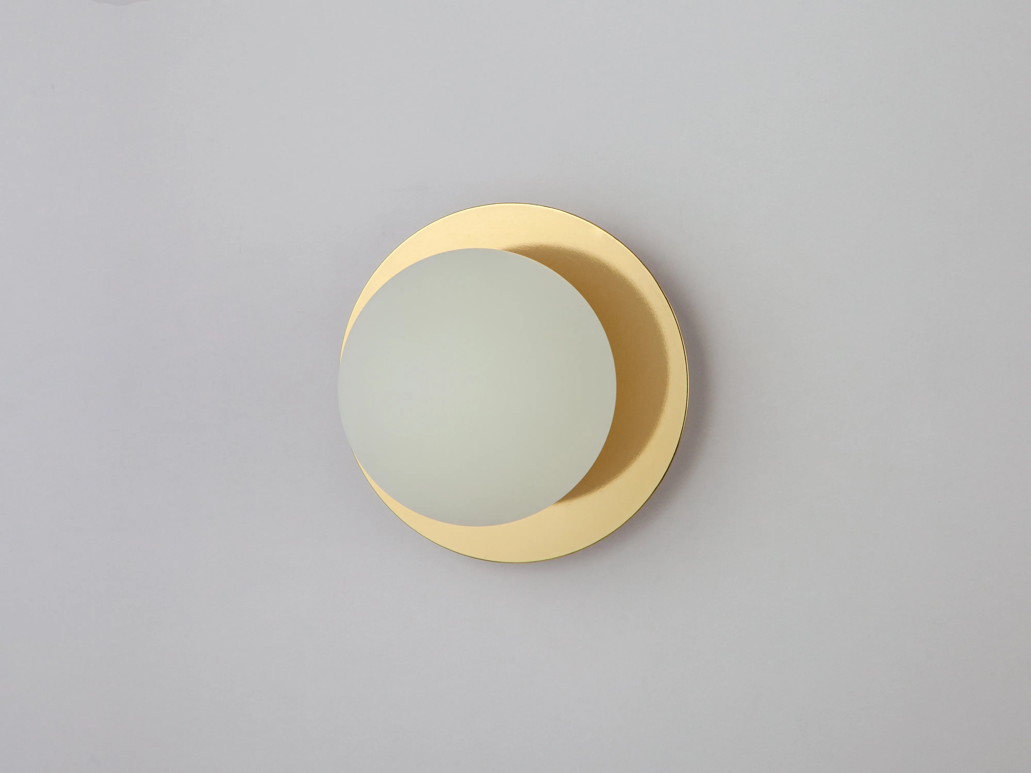 Brass opal disk wall light
