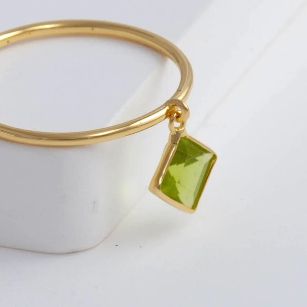 Swinging square peridot ring