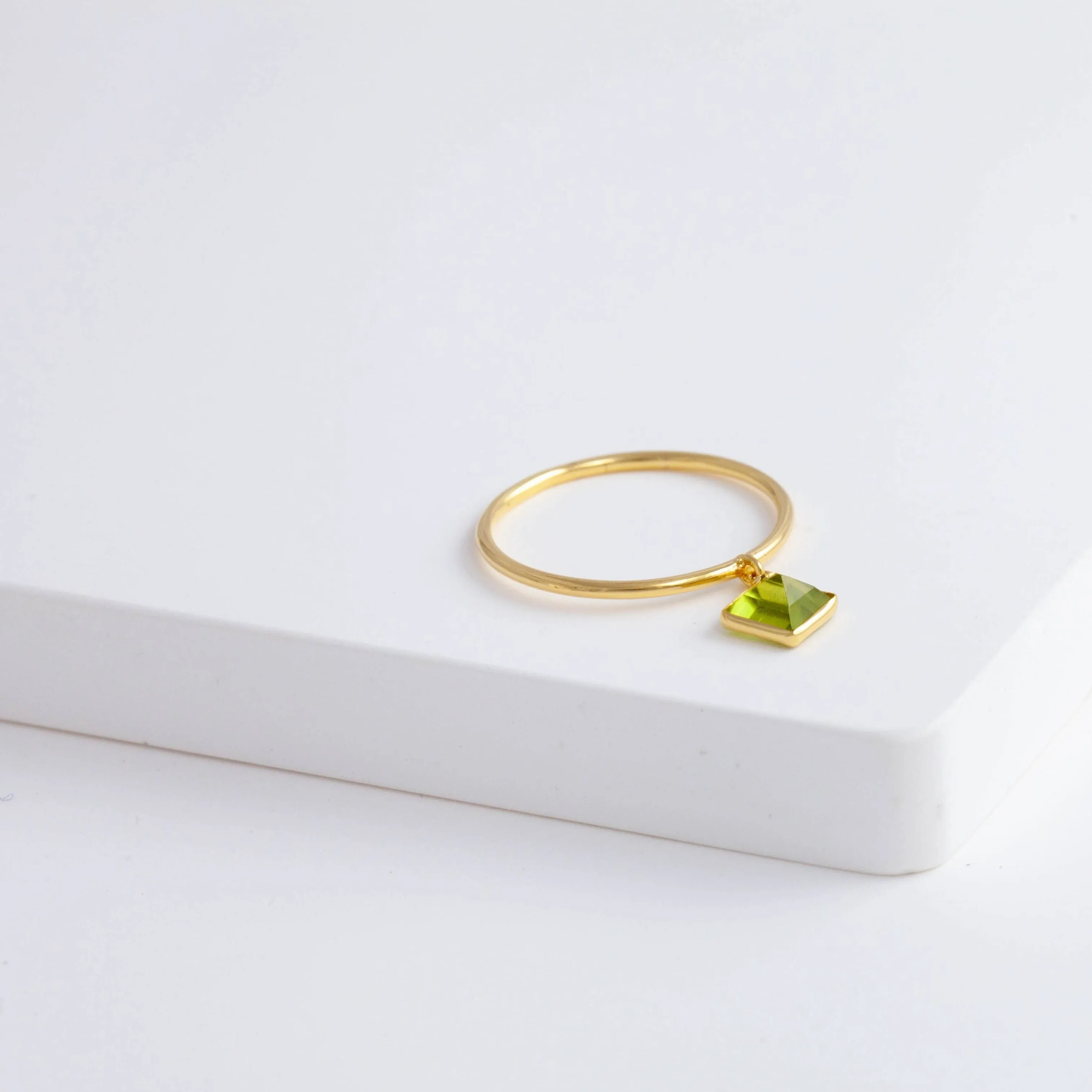 Swinging square peridot ring