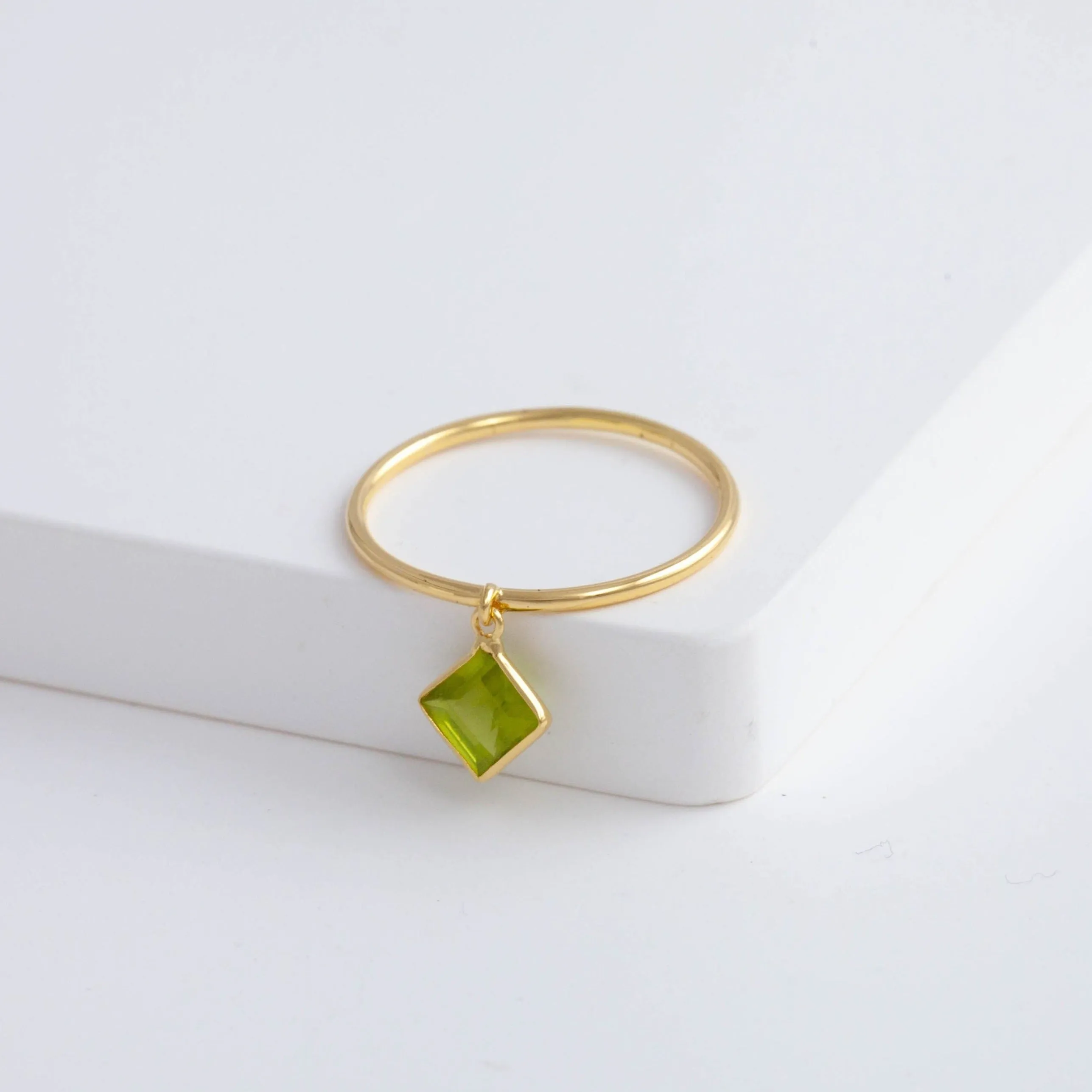 Swinging square peridot ring