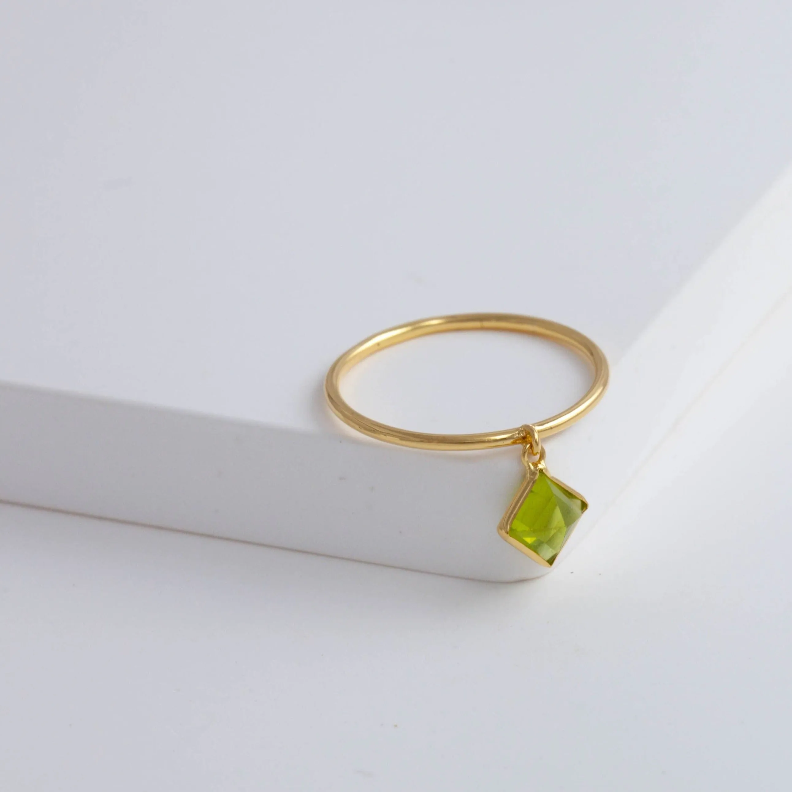 Swinging square peridot ring